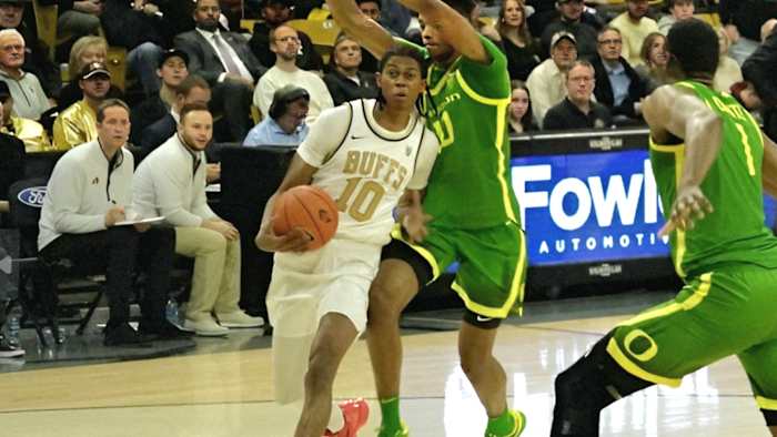 Cody Williams driving to the hoop vs. Oregon